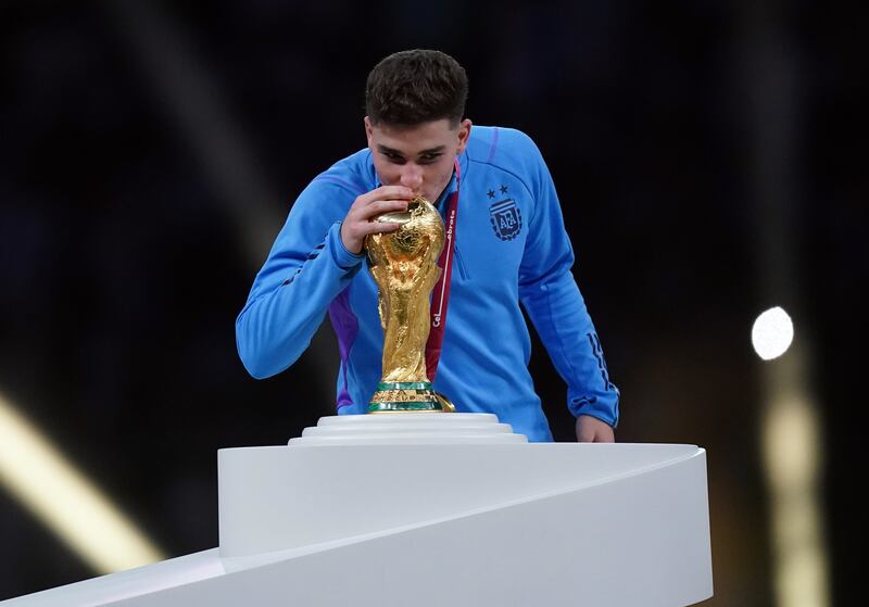 Julian Alvarez kisses the World Cup after Argentina beat France to win it in Qatar in 2022