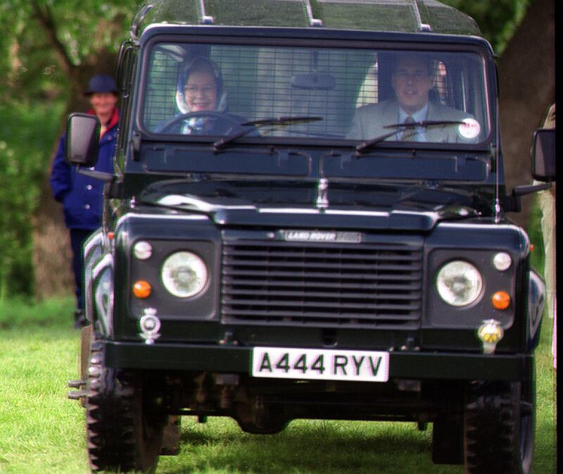 Queen Elizabeth II driving her personally commissioned Land Rover Defender 110 V8 at the Royal Windsor Horse Show.