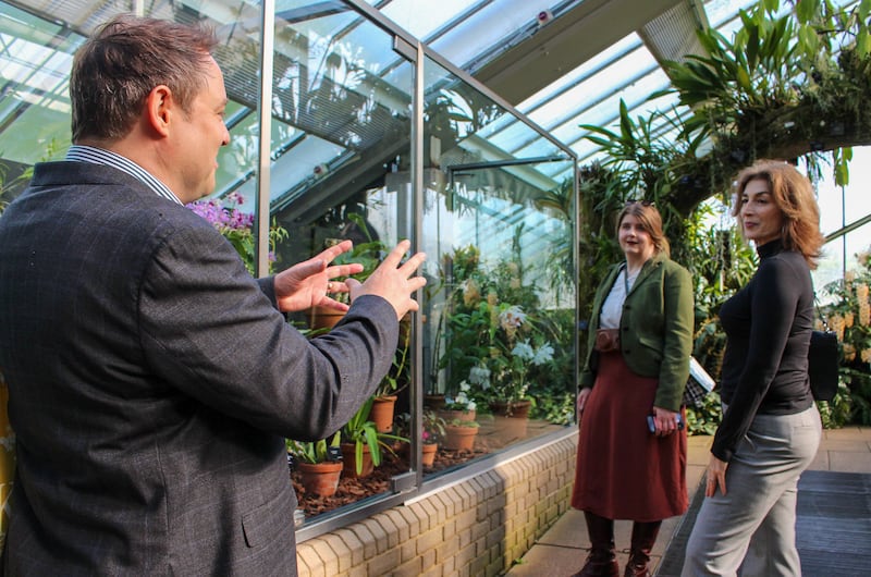 David Whitehead, Kew project manager, Elizabeth Topolosky, eBay’s Senior Regulatory Counsel, and Traci Andrighetti, eBay’s Global Regulatory Specialist, in the Princess of Wales Conservatory at Kew Gardens. (Royal Botanic Gardens Kew)