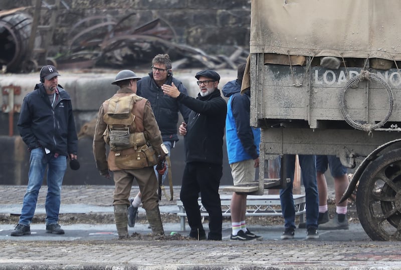 Director Sam Mendes with actor George Mackay on the set of 1917