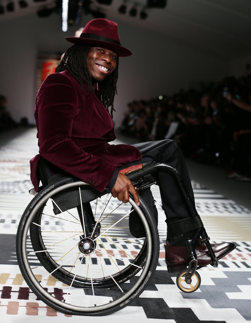 Ade Adepitan on the catwalk during the Fashion for Relief show in 2015