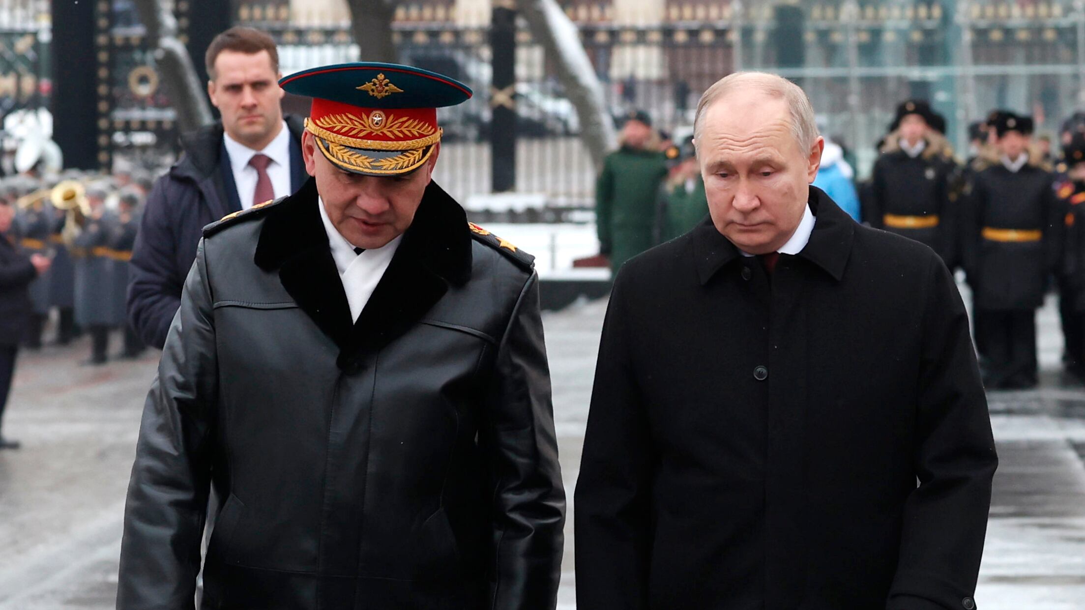 Russian President Vladimir Putin, right, and defence minister Sergei Shoigu take part in a wreath-laying ceremony at the Tomb of the Unknown Soldier in Alexander Garden on Defender of the Fatherland Day, in Moscow, Russia (Alexander Kazakov, Sputnik, Kremlin Pool Photo via AP)