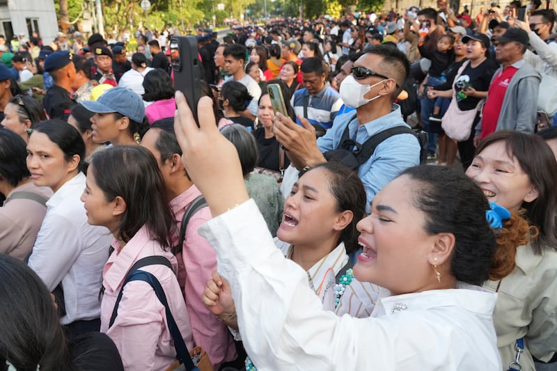 The faithful waited for Francis outside the Cathedral of Our Lady of the Assumption (AP)