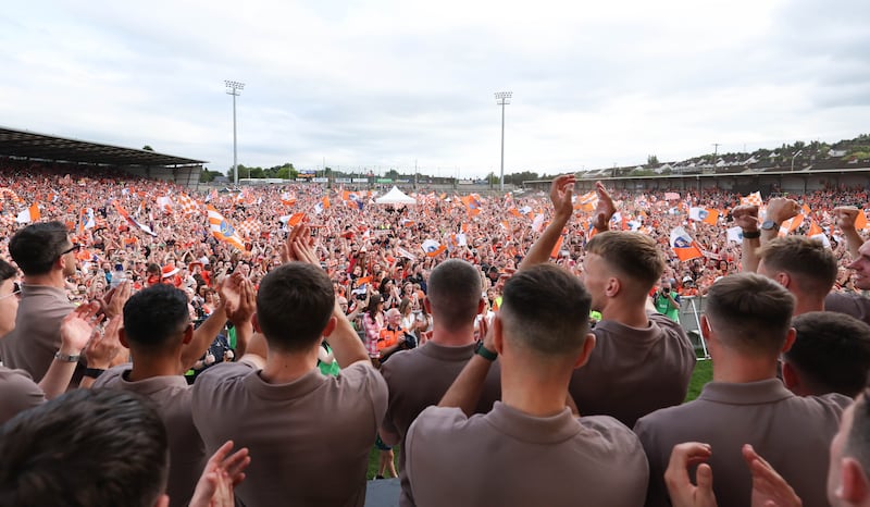 Armagh celebrate  with the fans at the Athletic grounds in Armagh on Monday, after winning the All Ireland.
PICTURE COLM LENAGHAN