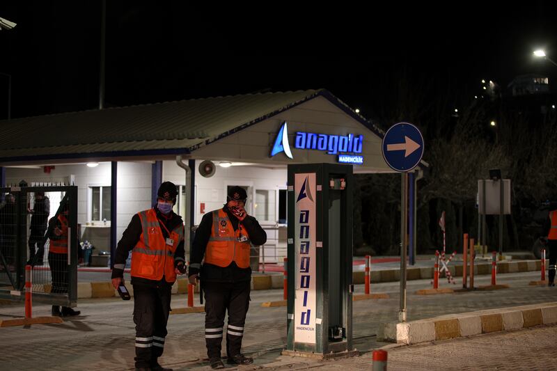 Security personnel stand at the entrance of the Copler gold mine near Ilic village, eastern Turkey (Ugur Yildirim/AP)