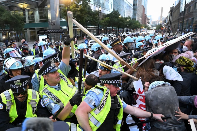 Demonstrators clash with police near the Israeli Consulate (Noah Berger/AP)