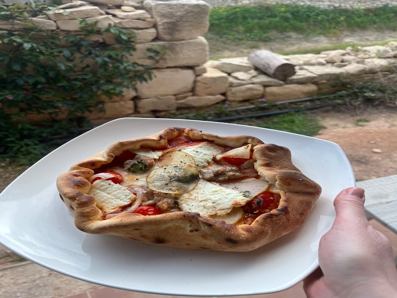 Homemade Ftira, a traditional pizza-like Maltese bread,is a tasty delicacy