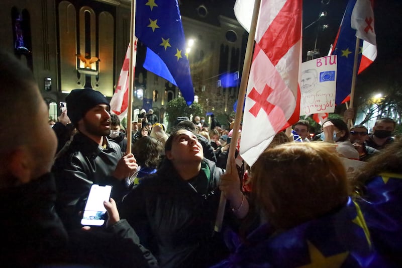 Protesters pour into the streets following the country’s ruling party suspended negotiations to join the European Union until 2028 (Zurab Tsertsvadze/AP)