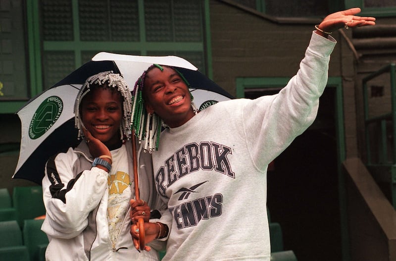 Venus Williams (R, with her sister Serena) played her first Wimbledon in 1997