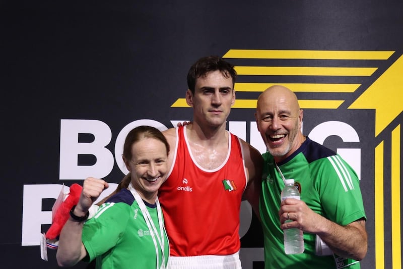 Aidan Walsh celebrates with Irish coaches Lynn McEnery and Damian Kennedy after sealing his Olympic qualification on Sunday. Picture by Joe Walsh