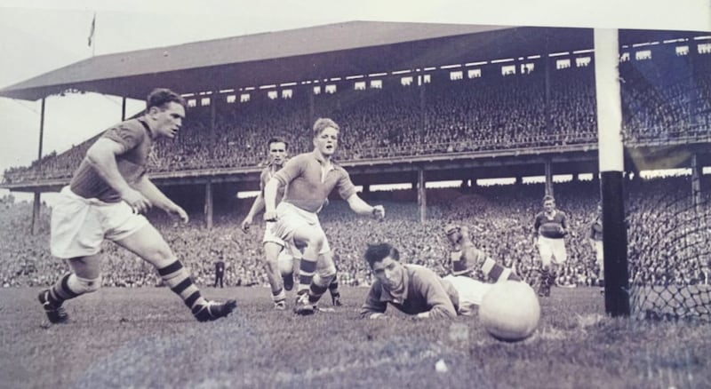 John McKnight (centre) in action for Armagh in the 1953 All-Ireland senior football final against Kerry in Croke Park 