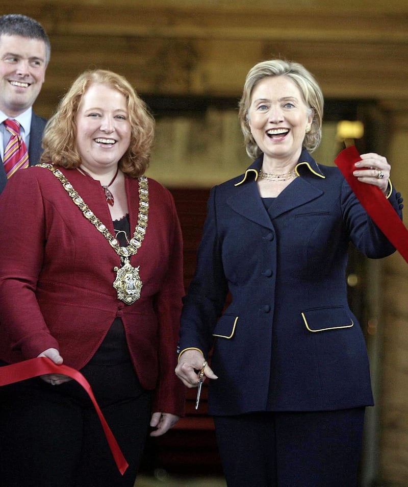 Naomi Longbegan her political career at Belfast City Council, where she served as Lord Mayor. She is pictured Hillary Clinton pictured at the re-opening of City Hall in 2009 