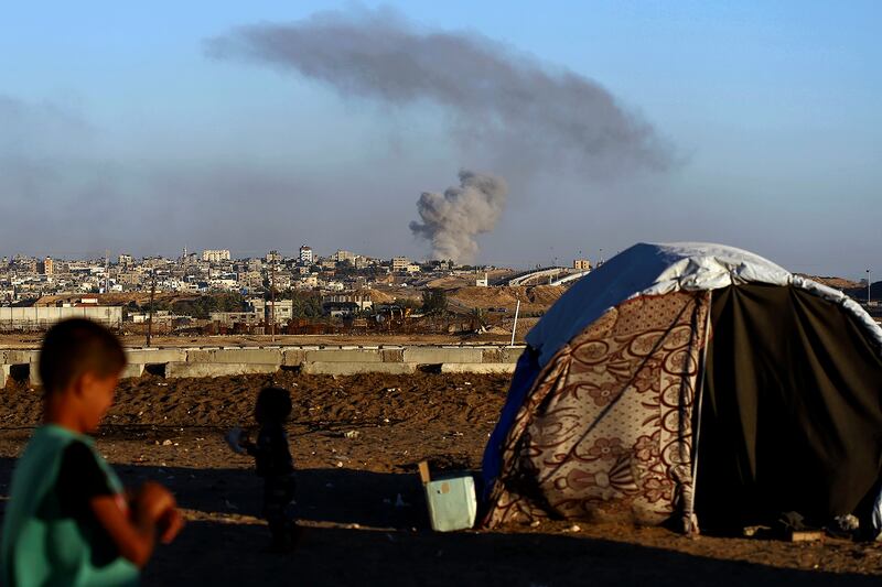 Smoke rises following an Israeli airstrike on buildings in Rafah (Ramez Habboub/AP)