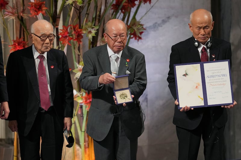 Terumi Tanaka, Shigemitsu Tanaka and Toshiyuki Mimaki, from left, representatives of this year’s Nobel Peace Prize winner Nihon Hidankyo (Kin Cheung/AP)