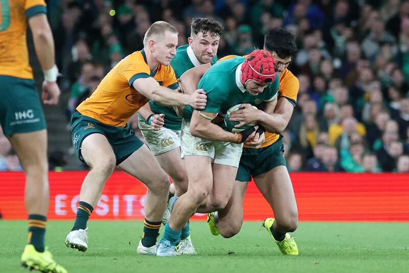 Ireland’s Josh van der Flier is tackled