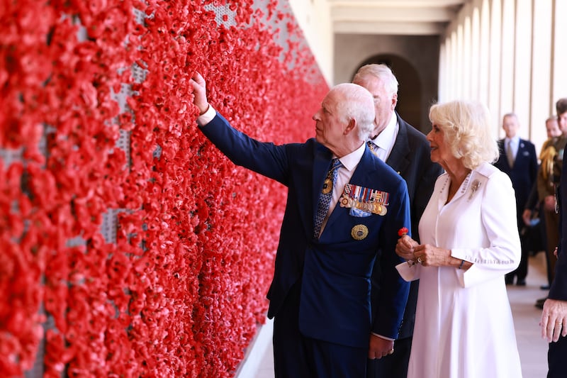 The King and Queen view the Wall of Remembrance during a visit to the Australian War Memorial in Canberra