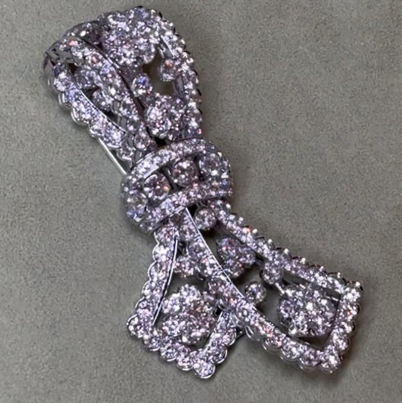 A Van Cleef & Arpels brooch was also taken.