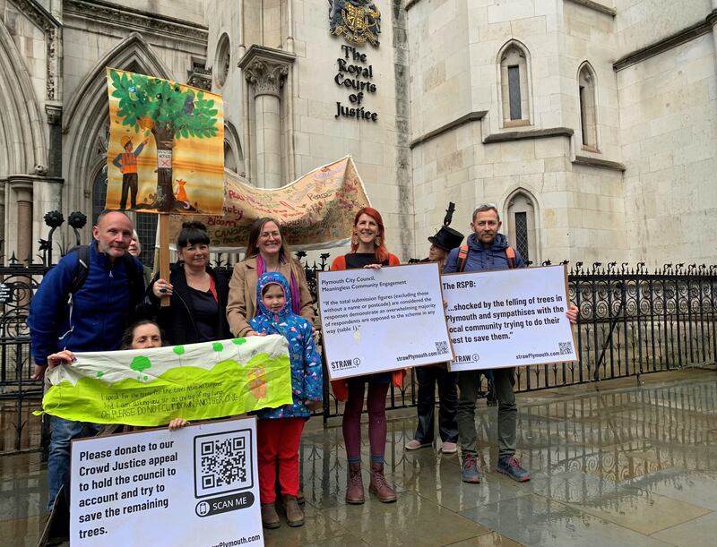 EDITORS NOTE PARENTAL CONSENT GIVEN Alison White, founder of campaign group Save the Trees of Armada Way (Straw), (centre) with fellow campaigners outside the Royal Courts of Justice in London at an earlier hearing in March