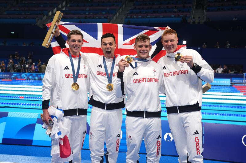 (L-R) Great Britain's Duncan Scott, James Guy, Matthew Richards and Tom Dean pose with their gold medals after winning the Men's 4 x 200m Freestyle Relay Final at the Paris La Defense Arena on the fourth day of the 2024 Paris Olympic Games in France.
Picture date: Tuesday July 30, 2024.
PA Photo.
Photo credit should read: John Walton/PA Wire.