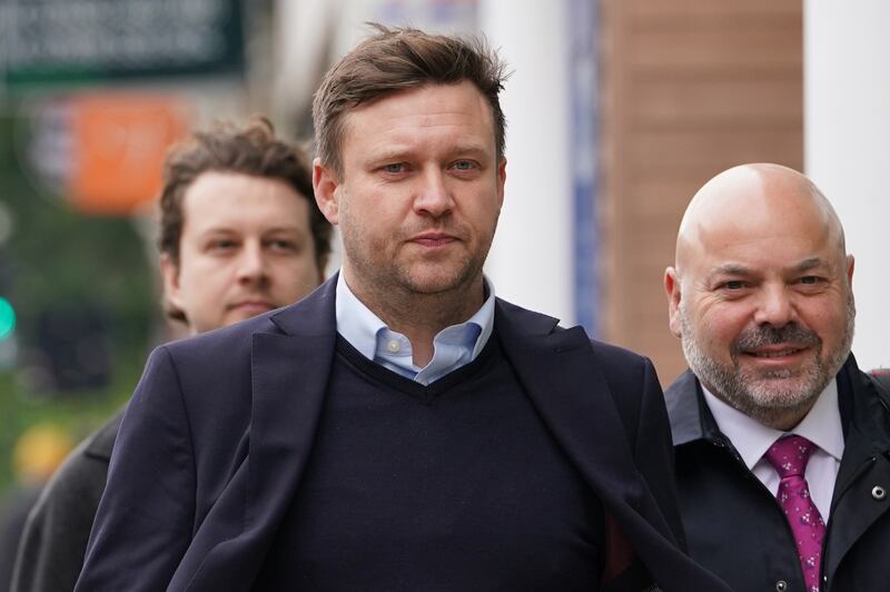 Scott Law, 43, (centre) arrives at Highbury Corner Magistrates’ Court