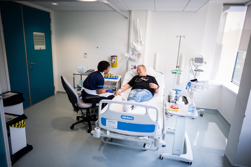 Patient Janusz Racz receives an injection of a BioNTech mRNA cancer immunotherapy for non-small cell lung cancer at the University College London Hospital clinical research facility