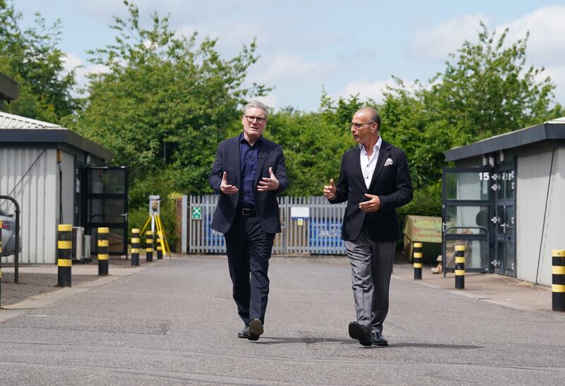 Labour Party leader Sir Keir Starmer and Theo Paphitis arrive for a visit to the Hampshire School of Jewellery in Basingstoke