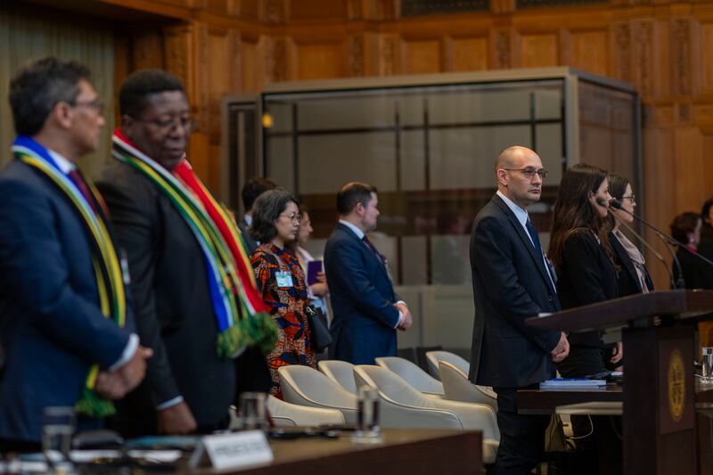 Front row from left, South Africa’s agents Cornelius Scholtz, Vusimuzi Madonsela and Israel’s agents Gilad Naom, Tamar Kaplan Tourgeman and co-agent Avigail Frisch Ben Avraham (Peter Dejong/AP)