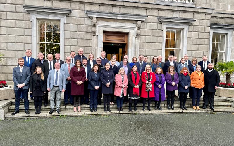 Mary Lou McDonald and Michelle O’Neill with Sinn Fein’s team of TDs outside Leinster House in Dublin on Wednesday