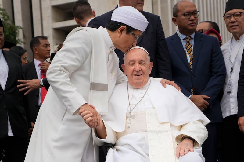 Grand Imam Nasaruddin Umar bids farewell to Pope Francis, as he leaves after signing the ‘Joint Declaration of Istiqlal 2024’ in Jakarta (Gregorio Borgia/AP)