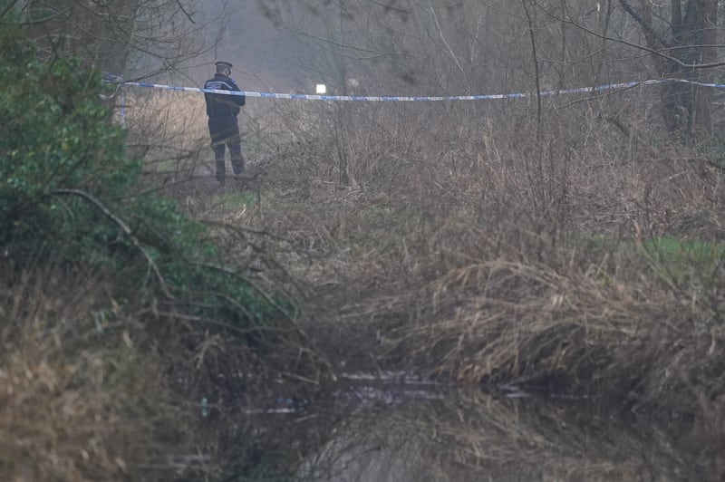 A police officer stands at a cordon close to the scene of the stabbing