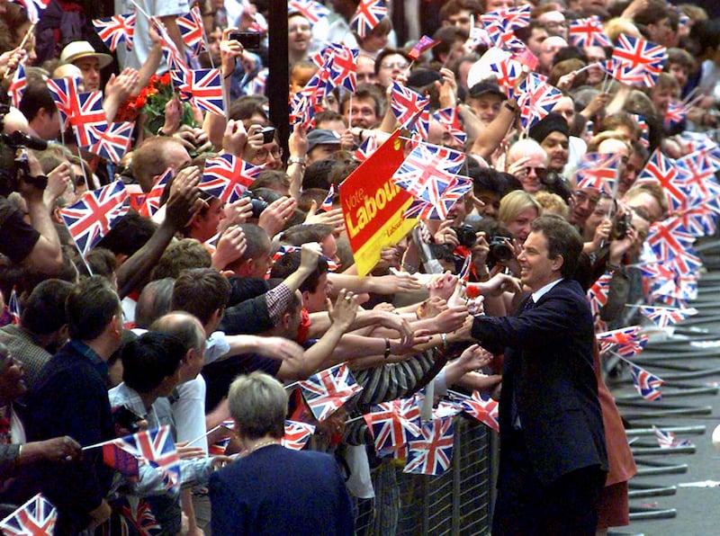 Tony Blair greets hundreds of supporters on his arrival at Downing Street for the first time as prime minister on May 2, 1997