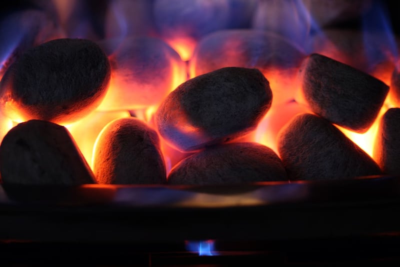 Ornamental coals glow on an open gas fire