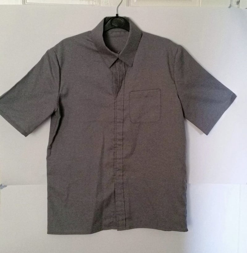 The autism friendly school shirt has a soft collar and imitation buttons, which means it can be put on over the head 