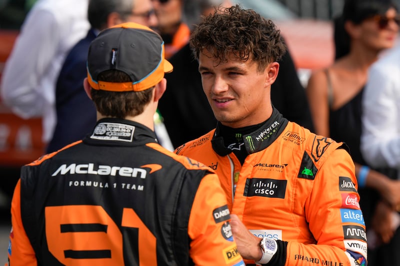 Lando Norris (right) was overtaken by team-mate Oscar Piastri (Luca Bruno/AP)