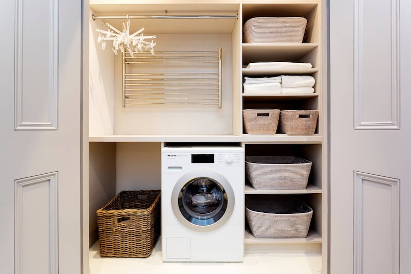 This tucked away utility space has ample storage and can be conveniently accessed and concealed when necessary (HUX London)