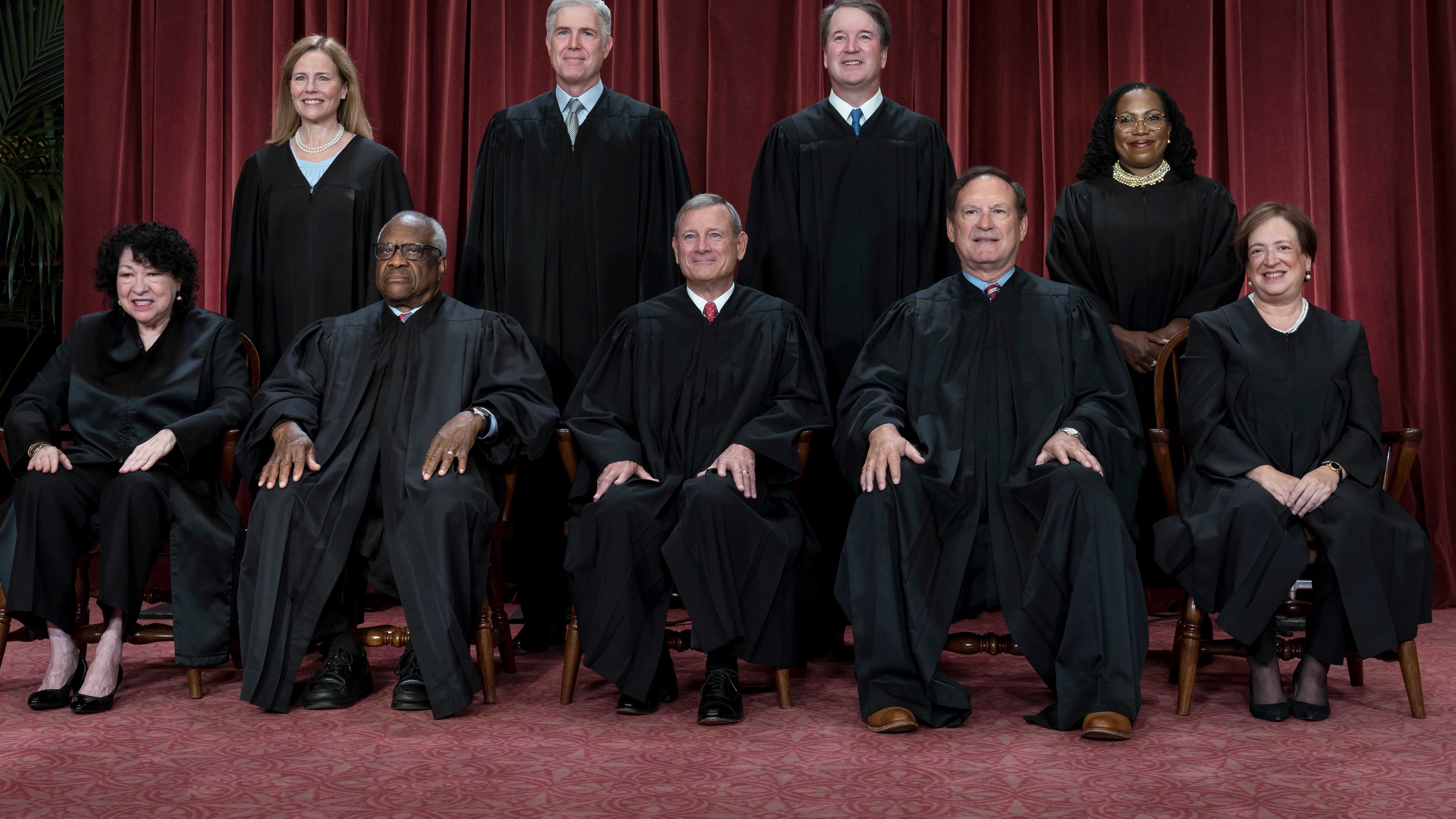 Members of the Supreme Court sit for a group portrait in Washington (J Scott Applewhite/AP)
