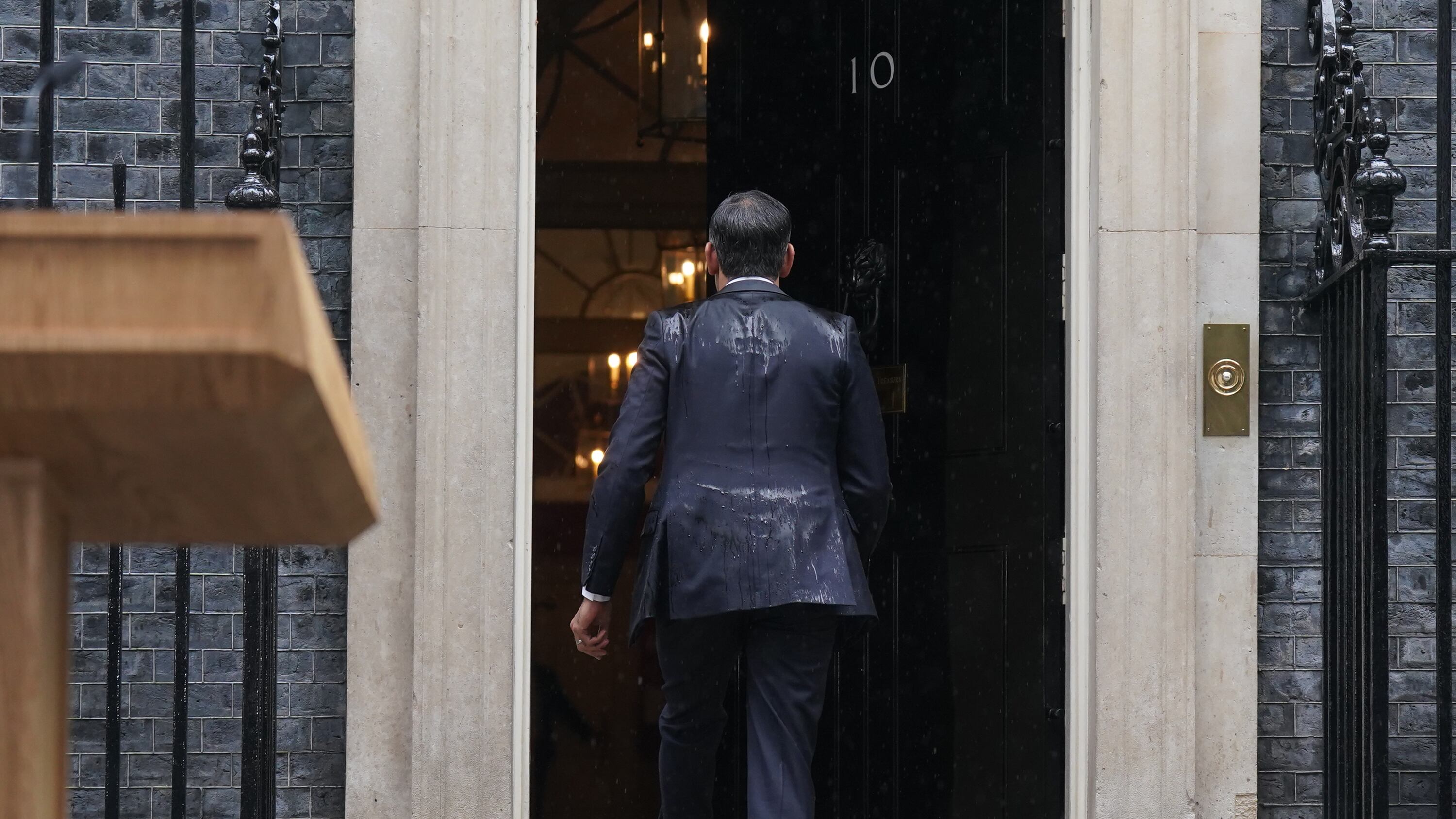 Prime Minister Rishi Sunak walks back into 10 Downing Street after announcing the General Election will take place on July 4