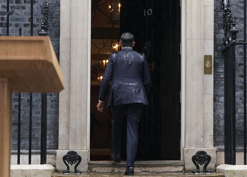 Prime Minister Rishi Sunak walks back into 10 Downing Street after announcing the General Election will take place on July 4