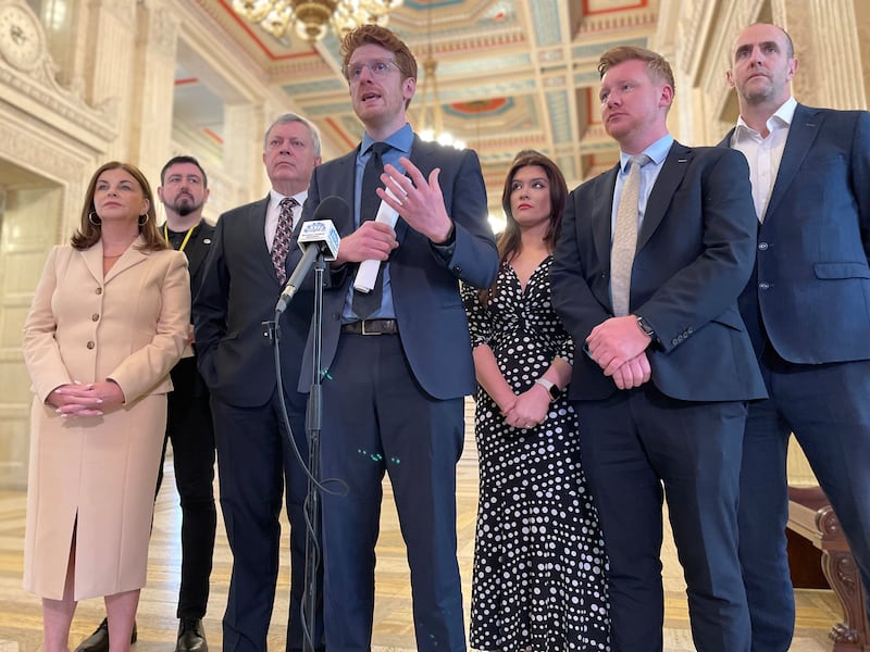 The SDLP's Matthew O'Toole (centre) speaks to media in the Great Hall at Parliament Buildings ahead of the Assembly's second Opposition Day