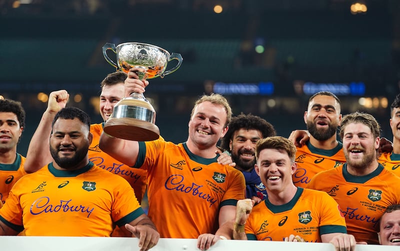 Australia players celebrate after beating England at Allianz Stadium