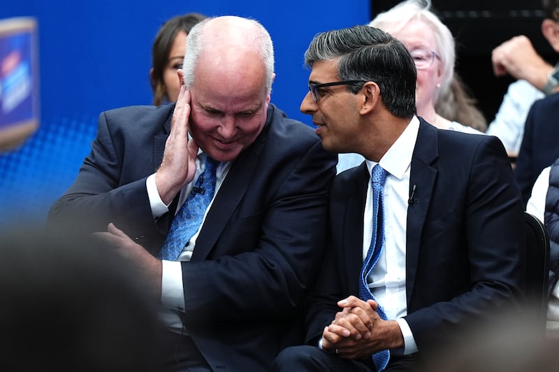 Rishi Sunak talking to Andrew RT Davies during a visit to Rhyl while on the General Election campaign trail