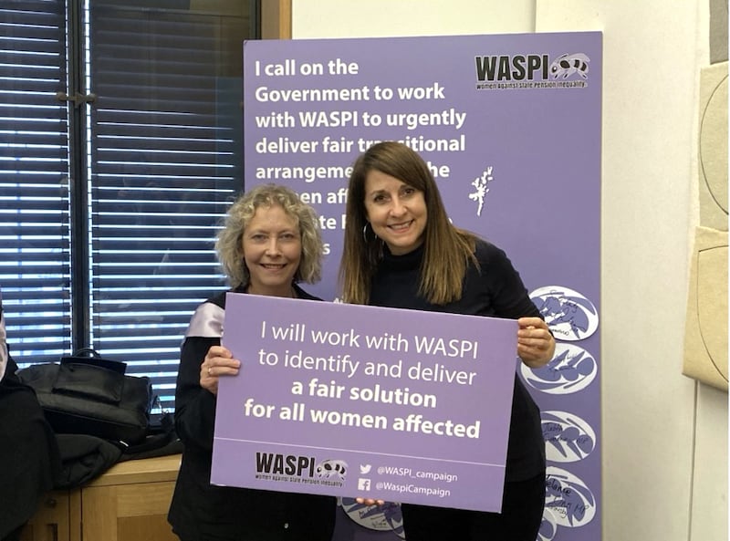 Secretary of State for Work and Pensions Liz Kendall (right) holding a placard in support of the Waspi campaign