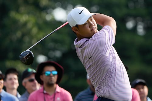 Tom Kim keeps lead as Shane Lowry and Robert MacIntyre shoot into contention