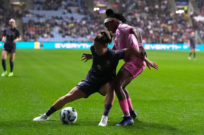 Maya Le Tissier and South Africa’s Hildah Magaia battle for the ball