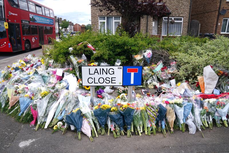 Floral tributes at the end of Laing Close near the scene in Hainault
