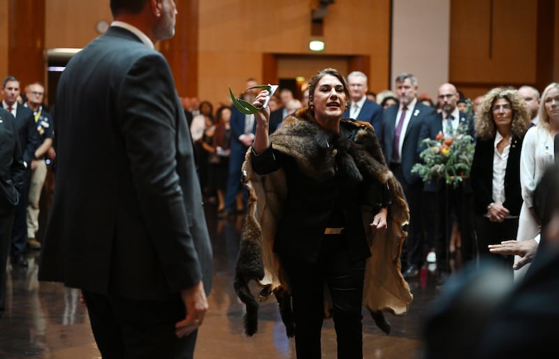 Australian senator Lidia Thorpe protests during the ceremonial welcome for the King and Queen in Canberra