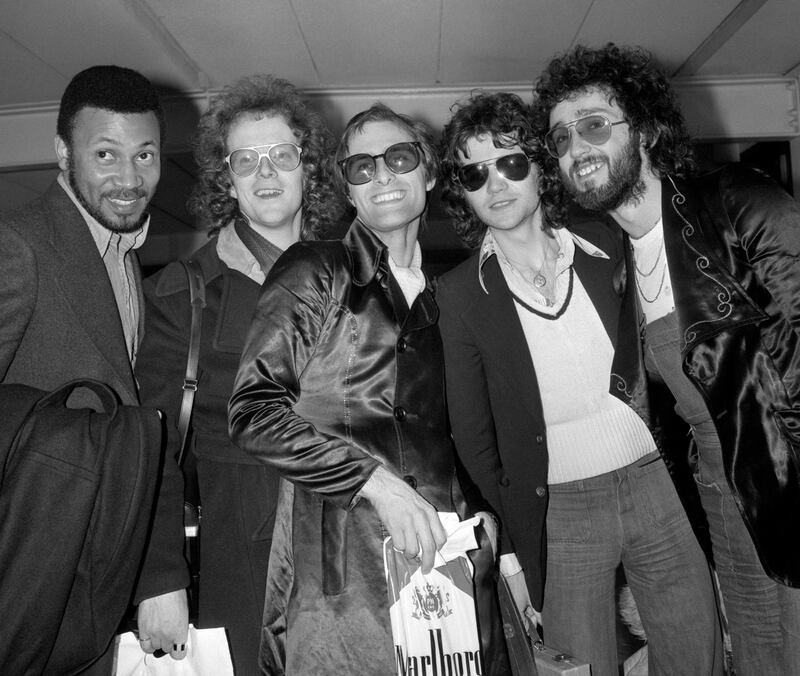 Steve Harley (centre) and Cockney Rebel, currently top of the best selling pop charts with Make Me Smile, at London’s Heathrow airport on their arrival from the US and two-week tour of one-night stands