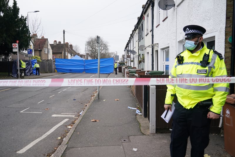 Police at the scene of the fire in Collingwood Road, Sutton