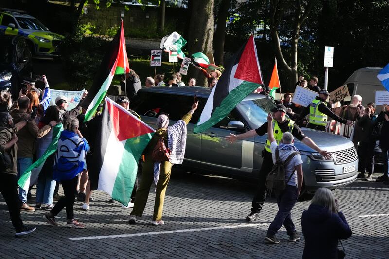 Pro-Palestinian protesters gather as the convoy carrying Prime Minister Sir Keir Starmer leaves Bute House in Edinburgh following his meeting with First Minister of Scotland John Swinney