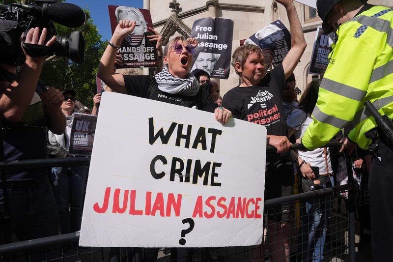Supporters of Julian Assange outside the Royal Courts of Justice in London